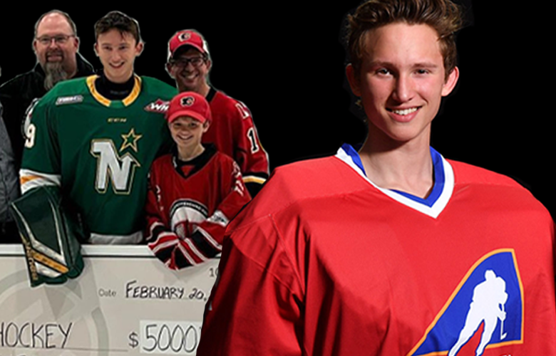 Image: Team Alberta Goaltender Ryley Budd stands with his Heroes Hockey Cheque.